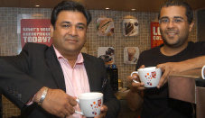 Novelist Chetan Bhagat (R) at launch of a new CCD outlet in B'lore